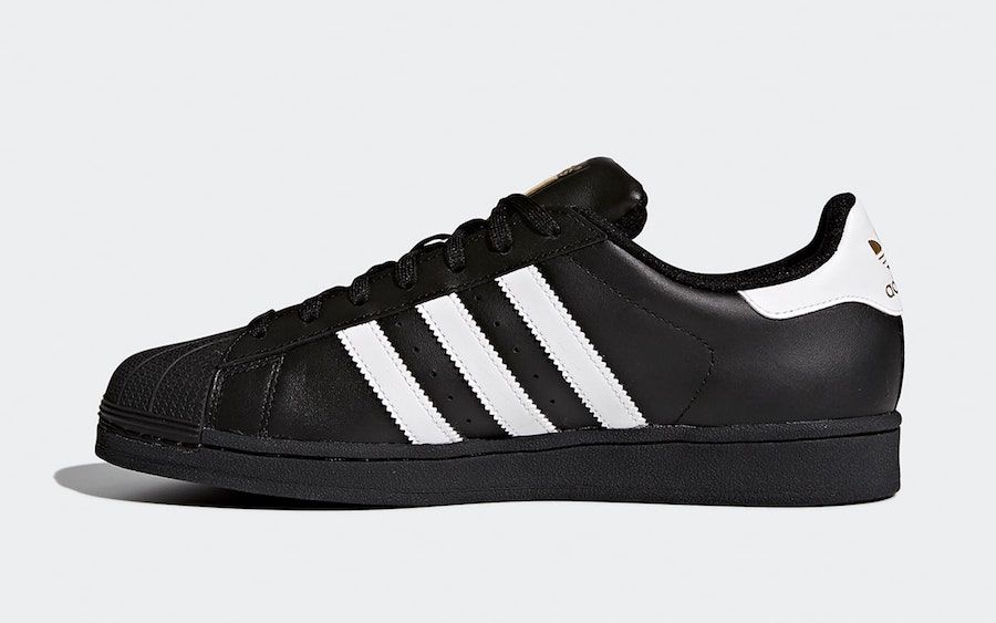 Black and white clearance and gold superstars