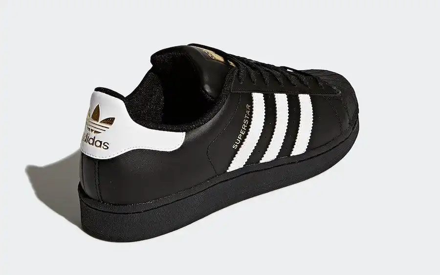 Black and white hotsell and gold adidas superstars